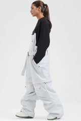 Peto para nieve holgado con múltiples bolsillos y cremalleras desmontables en color negro para mujer 