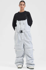 Peto para nieve holgado con múltiples bolsillos y cremalleras desmontables en color negro para mujer 