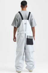 Peto para nieve holgado con múltiples bolsillos y cremalleras desmontables en color negro para hombre