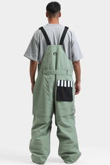 Peto para nieve holgado con múltiples bolsillos y cremalleras desmontables en color negro para hombre