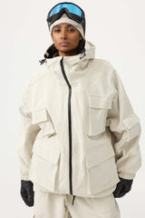 Chaqueta de nieve de pana impermeable de color rojo ladrillo con mangas de murciélago y bolsillo grande para mujer