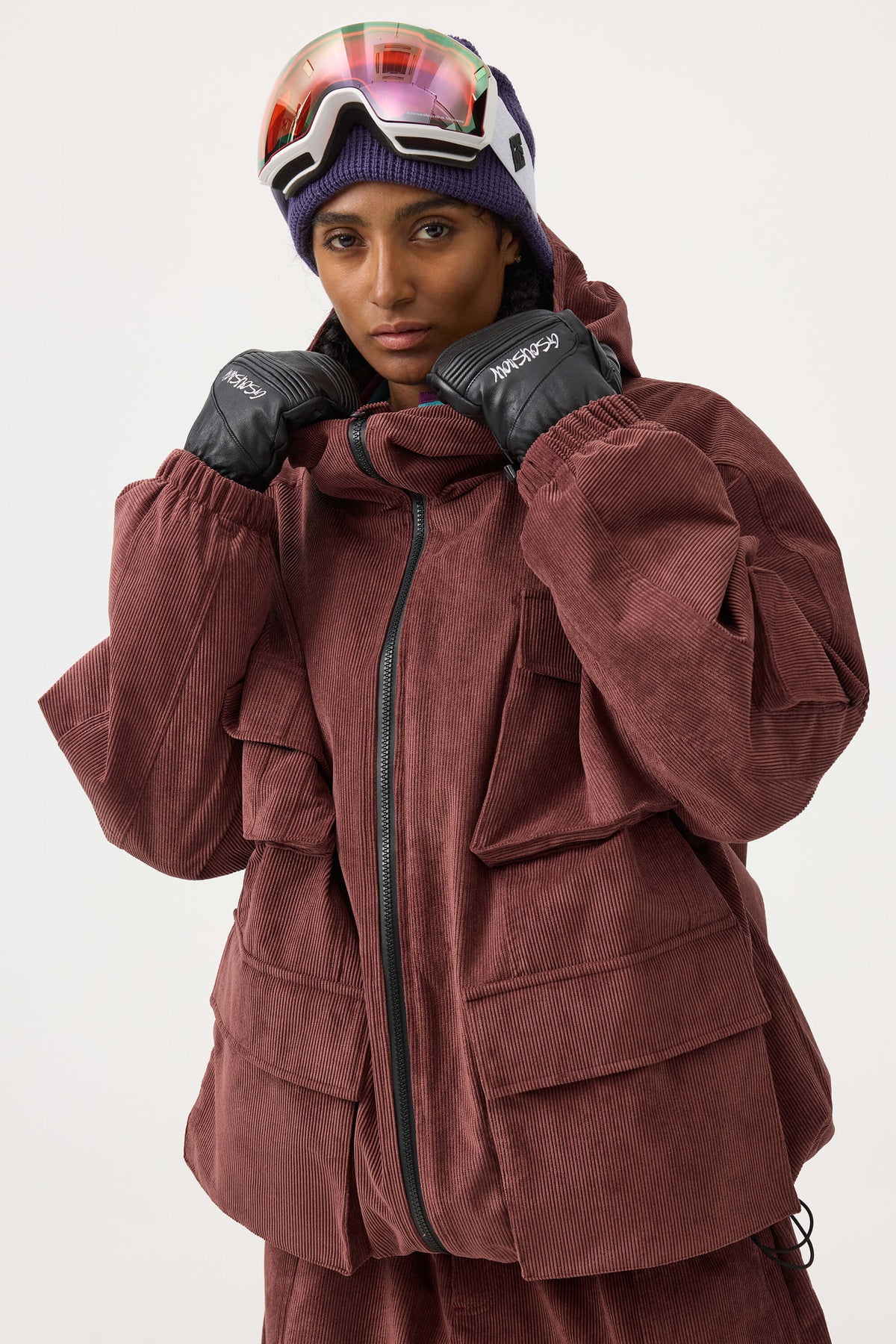 Chaqueta de nieve de pana impermeable de color rojo ladrillo con mangas de murciélago y bolsillo grande para mujer
