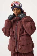 Chaqueta de nieve de pana impermeable de color rojo ladrillo con mangas de murciélago y bolsillo grande para mujer