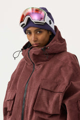 Chaqueta de nieve de pana impermeable con mangas de murciélago y bolsillo grande para mujer en color blanco roto