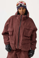 Chaqueta de nieve de pana negra impermeable con mangas de murciélago y bolsillo grande para mujer