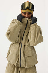 Chaqueta de nieve de pana impermeable de color rojo ladrillo con mangas de murciélago y bolsillo grande para mujer