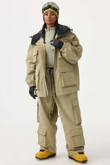 Chaqueta de nieve de pana negra impermeable con mangas de murciélago y bolsillo grande para mujer